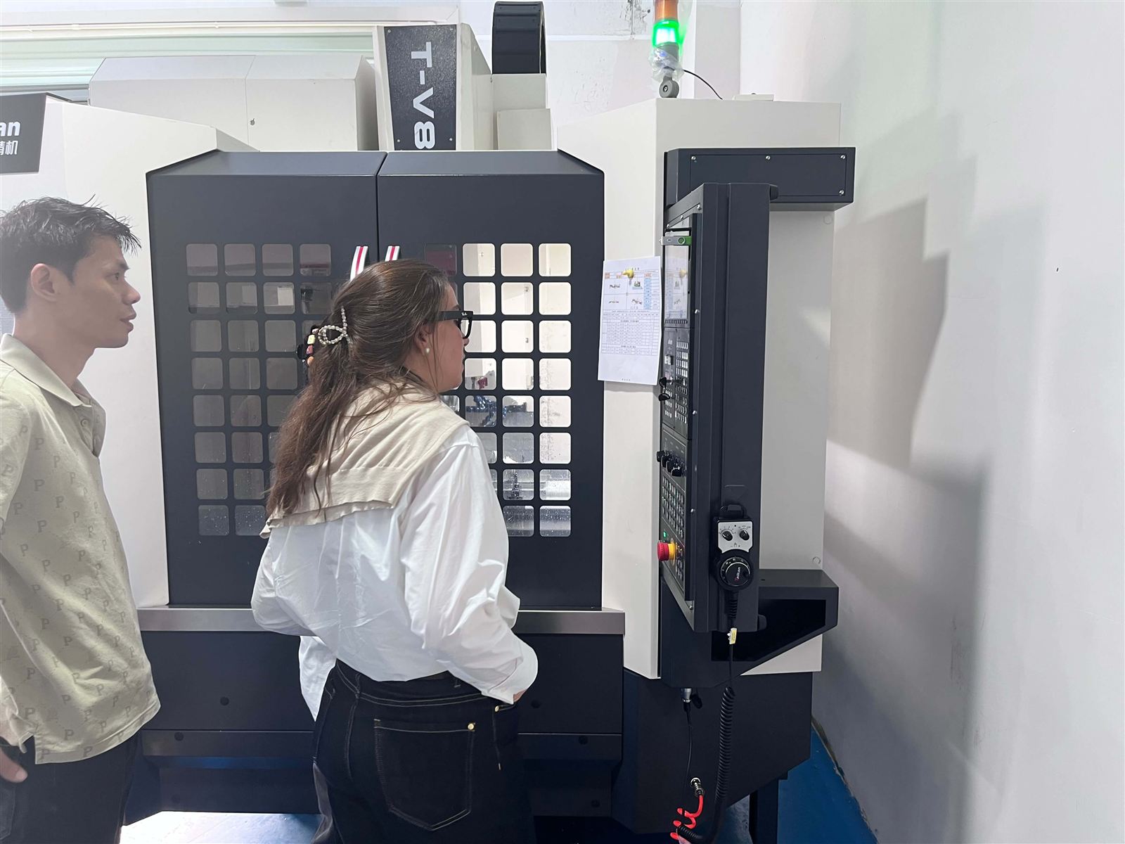 Customer reviewing CNC machining equipment