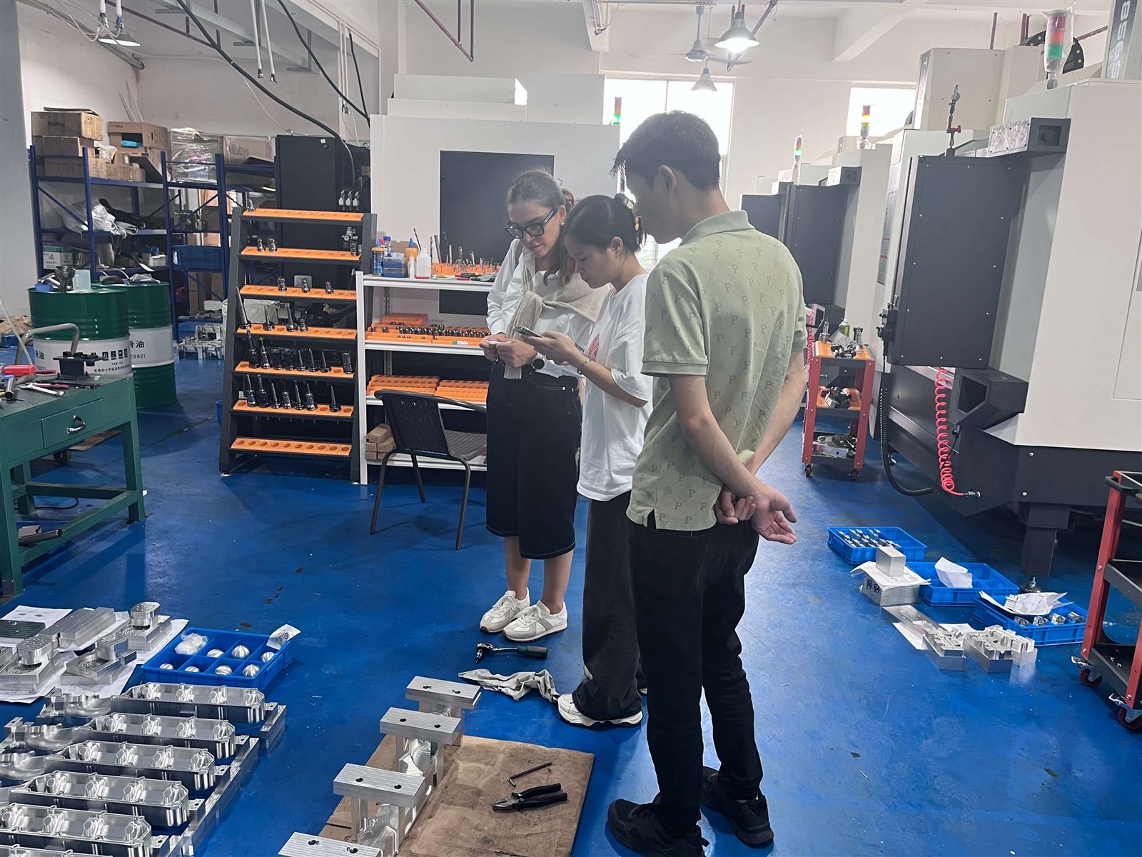 Customer touring the CNC machining workshop