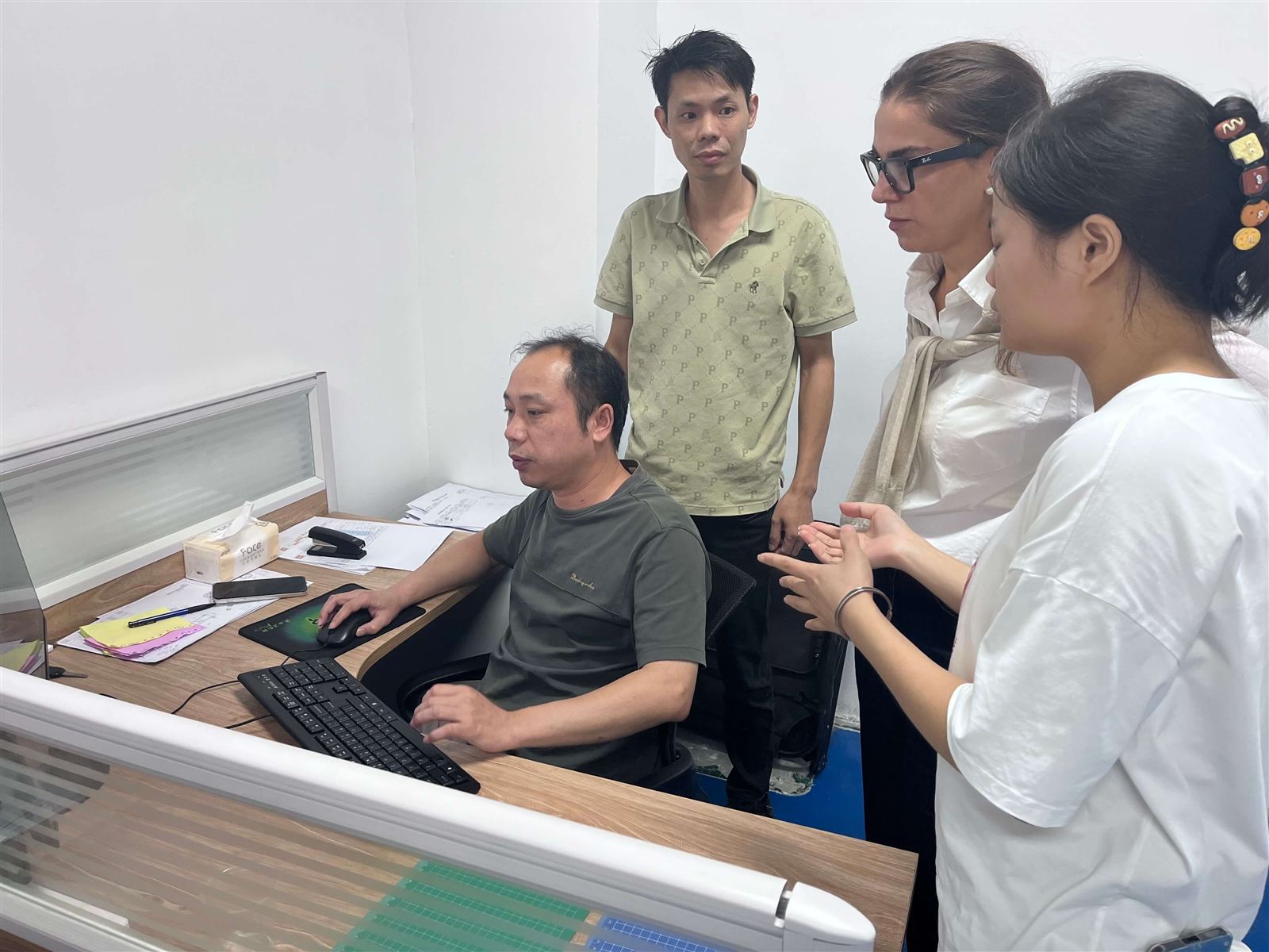Engineering discussion during a customer factory visit